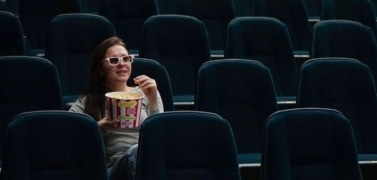 A woman watching a movie