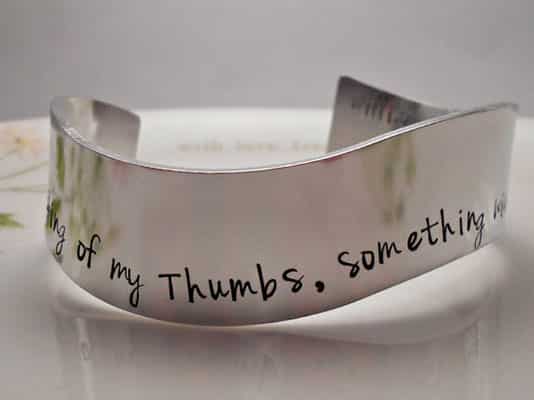 Bracelet etched with quotes from Macbeth