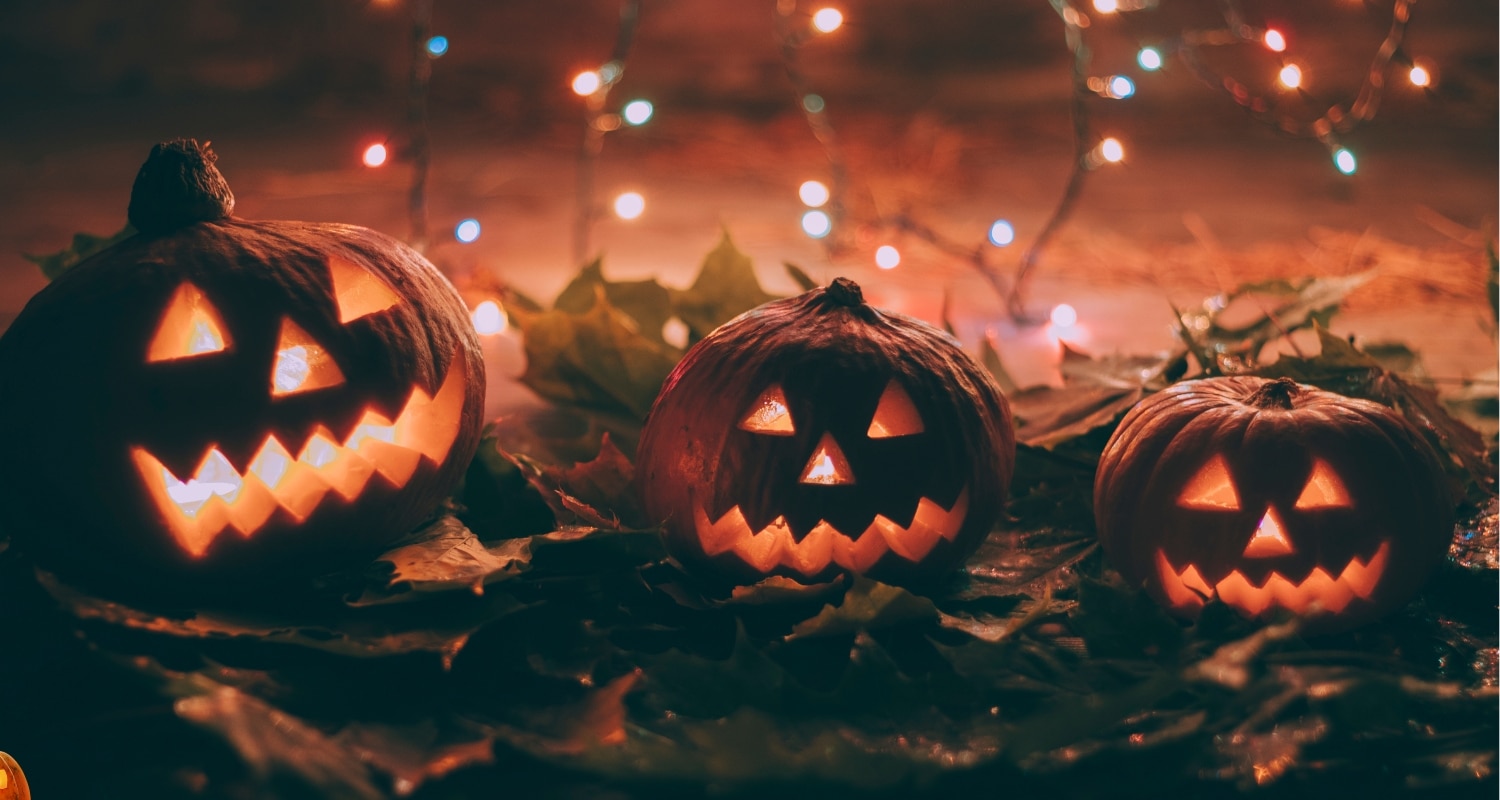 Haunting Halloween Scene with Three Scary Pumpkins